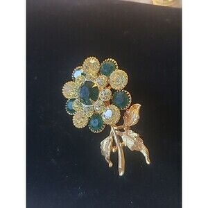 Gold Tone Flower Brooch With Green And Clear Stones